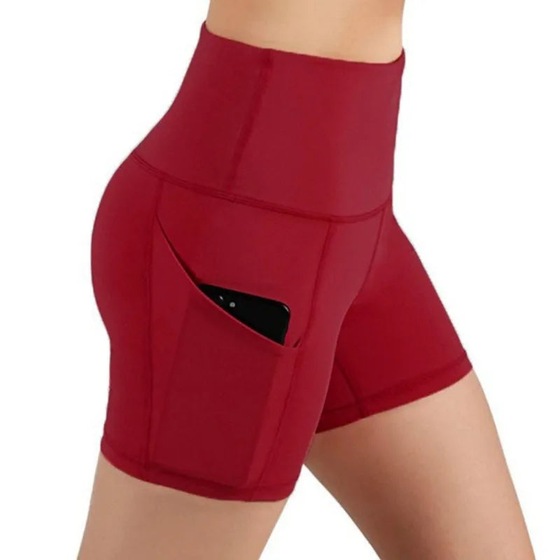 Versatile high-waisted fitness shorts with pockets for activewear.